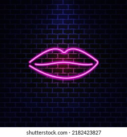 Lips fashion neon sign. Night bright signboard, glowing light banner. Summer logo, emblem. The concept of a club or bar on a dark brick wall background.