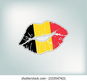 Lips painted in the flag of Belgium.