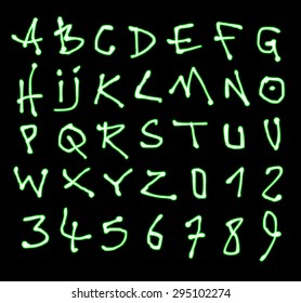 liquid font and number green neon alphabet over black