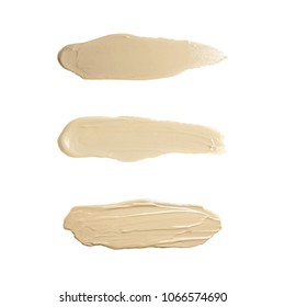 Liquid foundation tone smudge. Set concealer smear cosmetic cream isolated on white background, brown stroke texture. Makeup Vector
