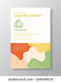 Liquid Soap Package Label Template. Abstract Shapes Camo Background Vector Cover. Cosmetics Packaging Design. Modern Typography and Hand Drawn Hazelnut Nut Sketch. Isolated.