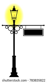 A lit gaslight with a blank hanging sign