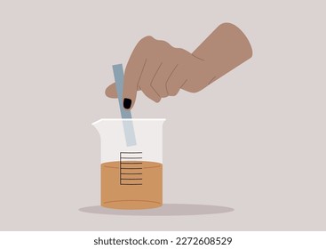 Litmus test, a hand putting a blue strip of paper into a glass beaker