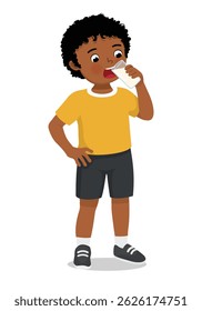 Little African boy drinking a glass of milk
