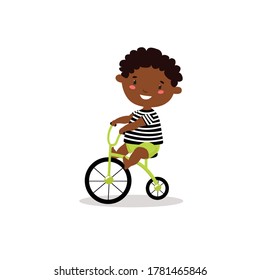 little african boy on a bicycle. Vector illustration. Cartoon baby.
