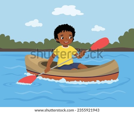 Little African boy rowing in the river