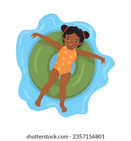 Little African girl lying on inflatable swim ring having fun floating in swimming pool on summer time