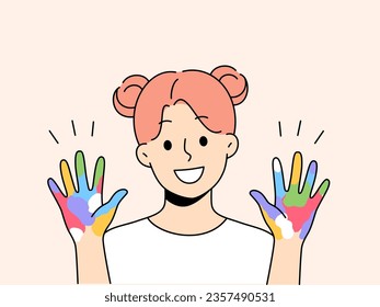 Little artist girl shows colorful palms painted with watercolors, offering to painting together. Schoolgirl who loves painting and creativity, dreams of creating masterpiece or working in field of art