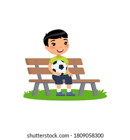 Little Asian boy with soccer ball in his hands sits on bench. Summer holidays, recreation, sports, hobbies. Vector flat illustration. Child cartoon character isolated on white background.