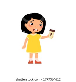 Little asian girl with takeaway coffee flat vector illustration. Cute kid with hot beverage cartoon character. Unhappy child holding paper cup with bitter energy drink isolated on white background