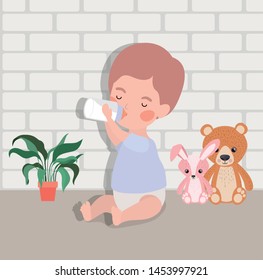 little baby boy with bottle milk and stuffed toys