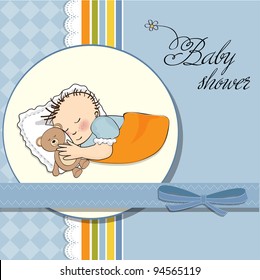 little baby boy sleep with his teddy bear toy