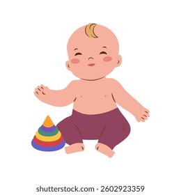 Little baby boy in stylish casual clothing barefoot sitting on floor, playing with colorful toy. Trendy baby clothing, learning, happy childhood concept