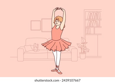 Little ballerina dreams of ballet, and practices dancing, standing in apartment, dressed in dress and pointe shoes. Girl ballerina stands on toes, demonstrating grace that comes from regular training.