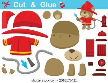 Little bear in firefighter uniform spraying water from hydrant. Cutout and gluing. Vector cartoon illustration