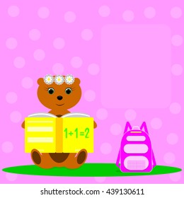 Little Bear sitting on meadow and reads the book