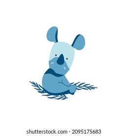 Little blue rhino sitting on a eucalyptus branch