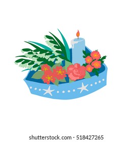 A little boat of offerings to sea goddess. Brazilian New Years Eve tradition. A blue boat decorated with stars and pearls, with flowers and a light blue candle burning, isolated on white background.