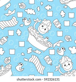 A little boy bathes in bath, in the foam with the rubber duck, paper boat , towel, shampoo, soap bubbles