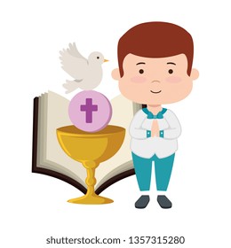 little boy with bible and chalice first communion