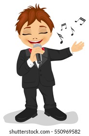 Little boy in black tuxedo with microphone sings a song. Isolated on white background