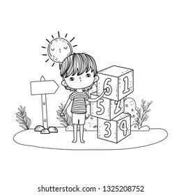 little boy with blocks numbers in the field