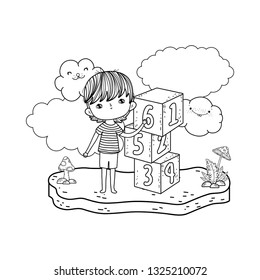 little boy with blocks numbers in the field