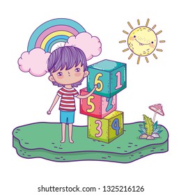 little boy with blocks numbers in the field