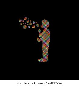 A little boy blowing soap bubbles designed using colorful pixels graphic vector.
