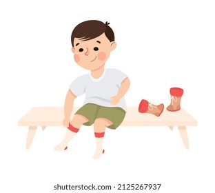 Little Boy Changing His Clothes Putting on Socks and Shoes Vector Illustration