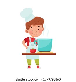 Little Boy Character in Hat and Apron Standing at Kitchen and Cooking Soup Vector Illustration