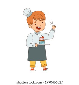 Little Boy Chef in White Toque and Jacket Holding Plate with Sweet Cupcake Vector Illustration