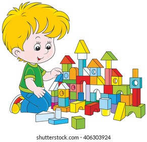little boy constructing a toy house with colored bricks