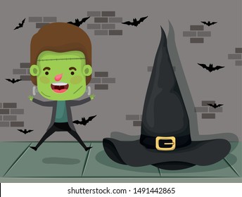 little boy with costume of frankenstein and witch hat
