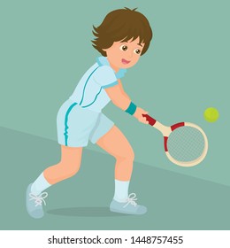 Little boy enjoying a game of tennis with a racket and ball