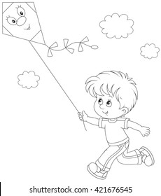 Little boy flying a kite