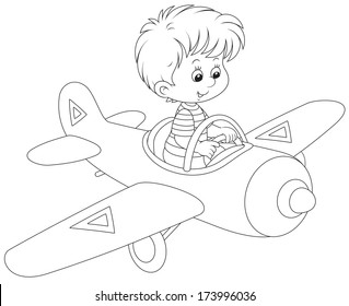 Little boy flying a toy plane