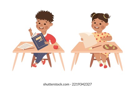 Little Boy and Girl Pupil Sitting at Table with Copybook and Paper Engaged in Elementary Education Vector Set