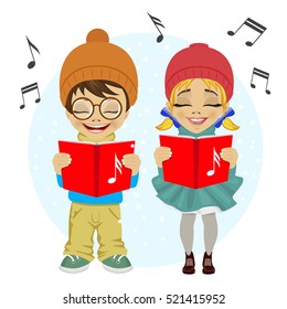 little boy and girl singing Christmas carols