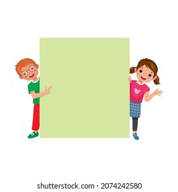 Little boy and girl standing behind blank board pointing finger and waving hand. Happy Kids peeking over empty banner.