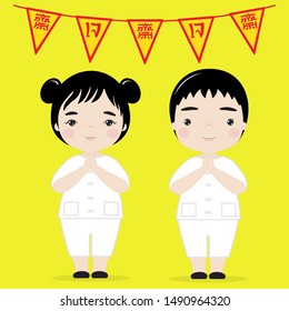 Little boy and girl in white shirt ,with Chinese and Thai language flags that mean "vegetarian"on a yellow  background.