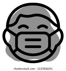 little boy grinning while wearing the face mask