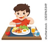 A little boy happy to eat breakfast in the morning.
