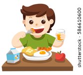 A Little boy happy to eat breakfast in the morning.