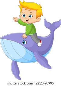 The little boy is so happy while riding a big whale in the ocean of illustration