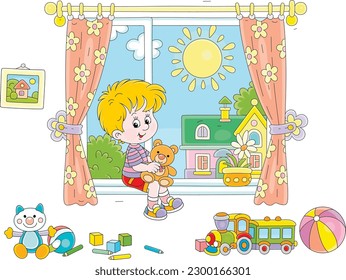 Little boy with his teddy bear and other funny toys in a nursery room by a window with curtains and a sunny summer landscape in a background, vector cartoon illustration on white