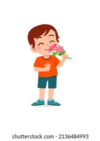 little boy holding flower and sniff the scent