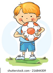 Little boy holding football