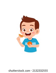 little boy holding fresh orange fruit from farm