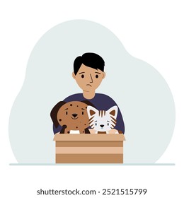 A little boy holds a cardboard box with a cat and a dog. The concept of rescue, help and care for pets.